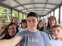 a group of people taking a selfie on a train