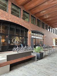 a brick building with bicycles parked in front of it