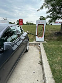 a tesla parked at a charging station